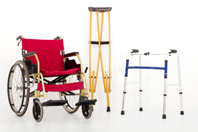 Caregiver, hands or elderly woman walking with walker for support